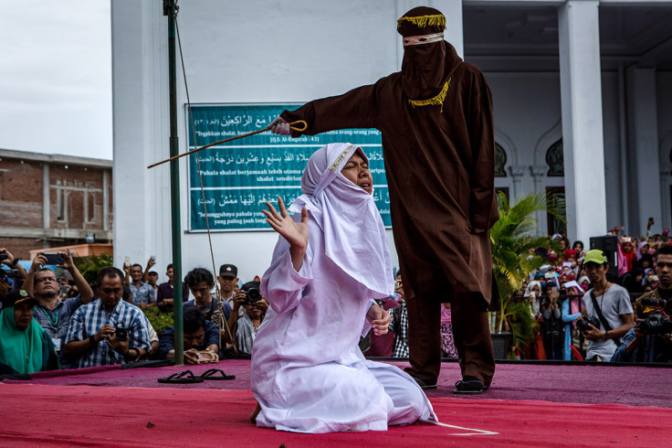 gay couple caned Aceh Indonesia shariah