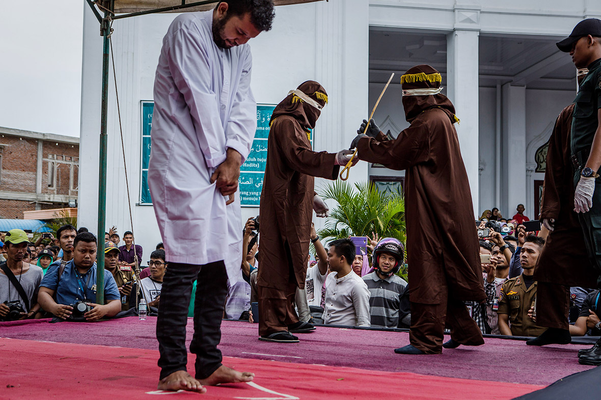 gay couple caned Aceh Indonesia shariah