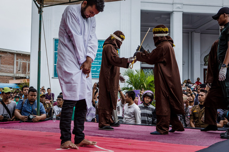 gay couple caned Aceh Indonesia shariah