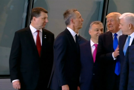 Trump shoves fellow NATO leader aside on his first summit