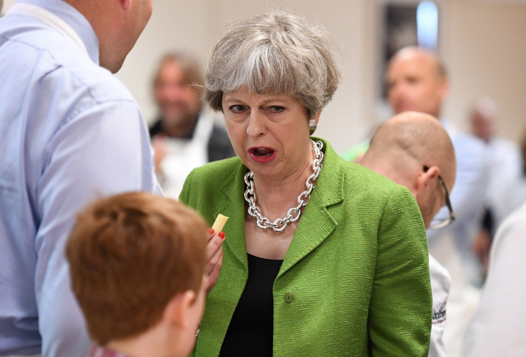 Theresa May eating cheese