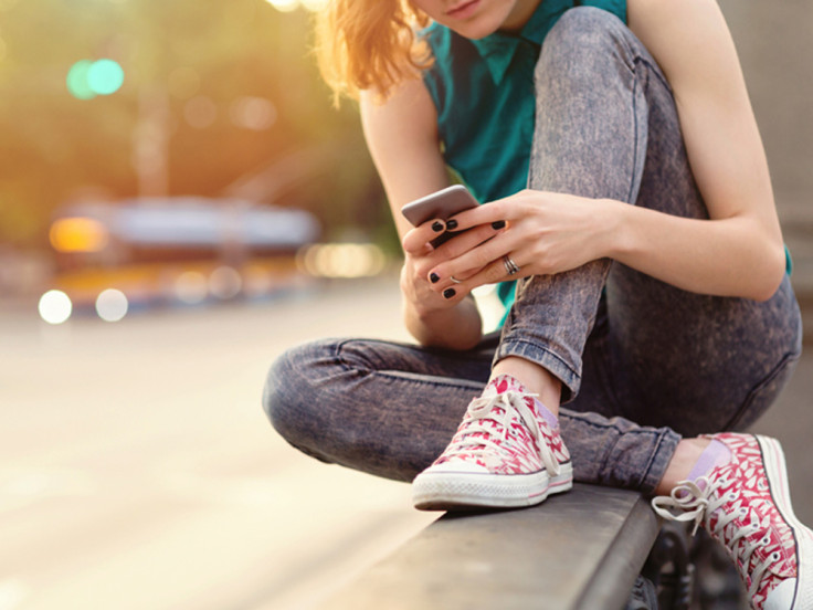 A teenager using a smartphone 