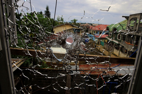 An abandoned hospital window is seen full of bullet holes in Marawi City
