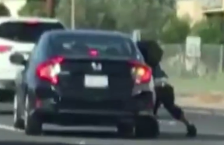 woman dragged by car