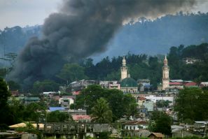 Smoke billows from a burning building as government troops continue their assault against insurgents from the Maute group, who have taken over large parts of Marawi city, Philippines June 16, 2017