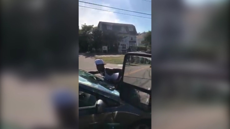Woman Clings Onto Car In Bizarre Traffic Incident