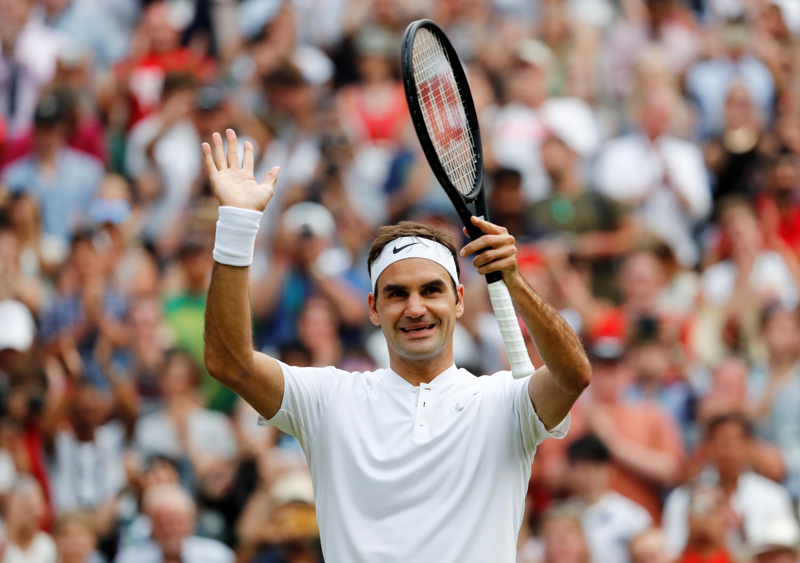 Roger Federer overcomes early jitters to defeat Dusan Lajovic and ...