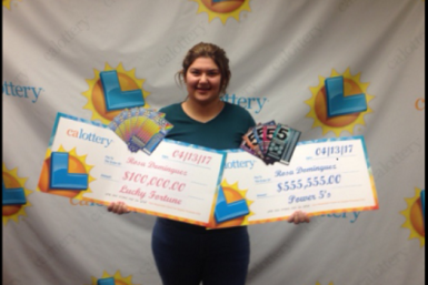 Rosa Dominguez and her two winning cheques