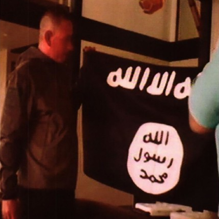 US army soldier kisses Isis flag