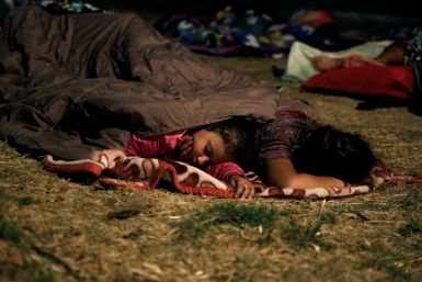Children sleep outside after Koss earthquake