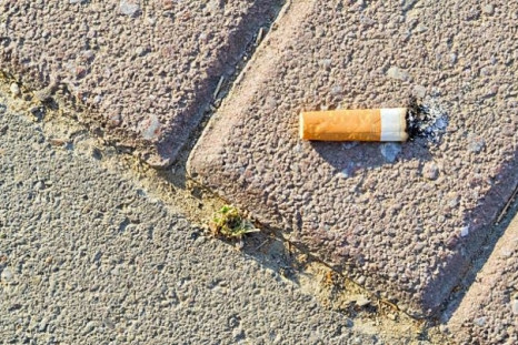 Cigarette butt pavement sidewalk