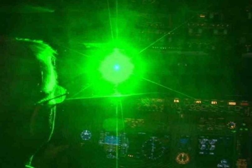 British father and teenage son face heavy fines for shining lasers at