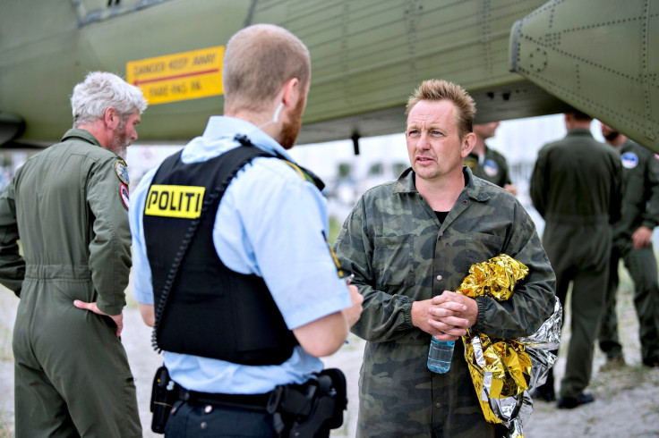  Danish submarine owner and inventor Peter Madsen talks to Danish police in Dragor Harbor south of Copenhagen, Denmark