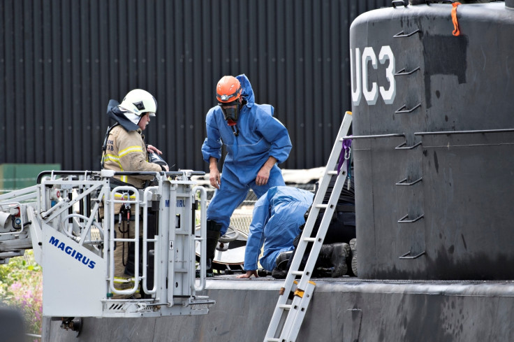 Police investigate the rescued private submarine "UC3 Nautilus" in Copenhagen Harbor, 
