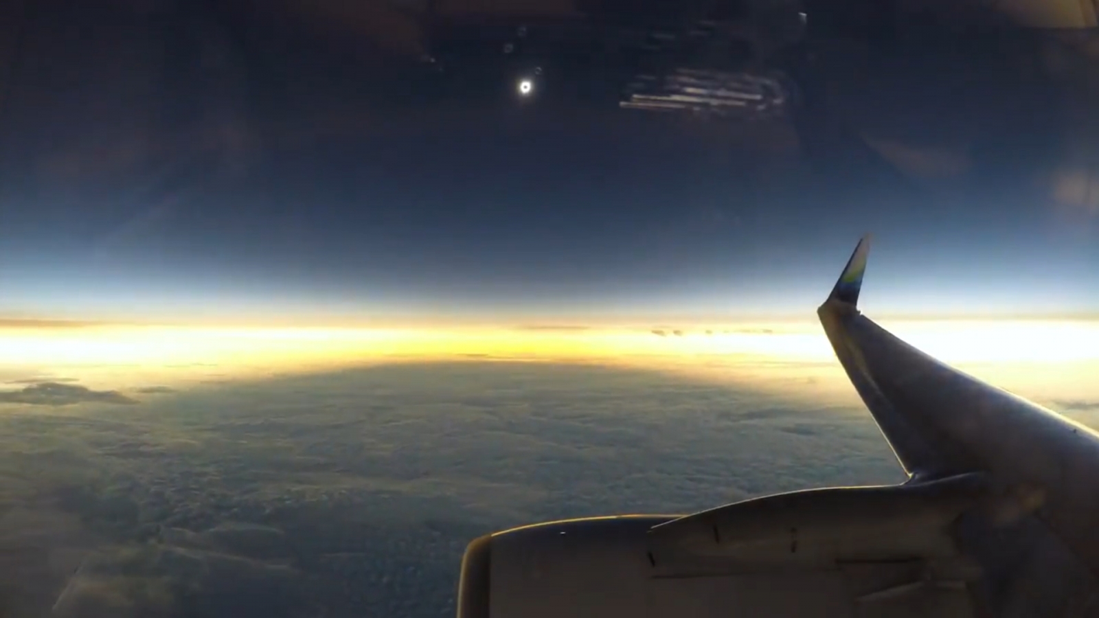 Stunning midflight video captures moment total solar eclipse plunges