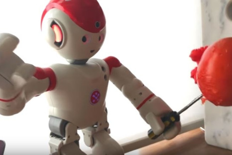 robot stabbing tomato