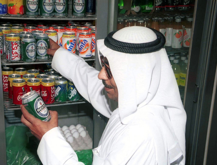 A Kuwaiti citizen Abu Yousif buys a can of non-alcoholic beer from a small grocery 