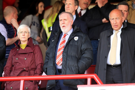 Barnsley Football Club, Patrick Cryne (middle), watching his team play at their Oakwell ground  