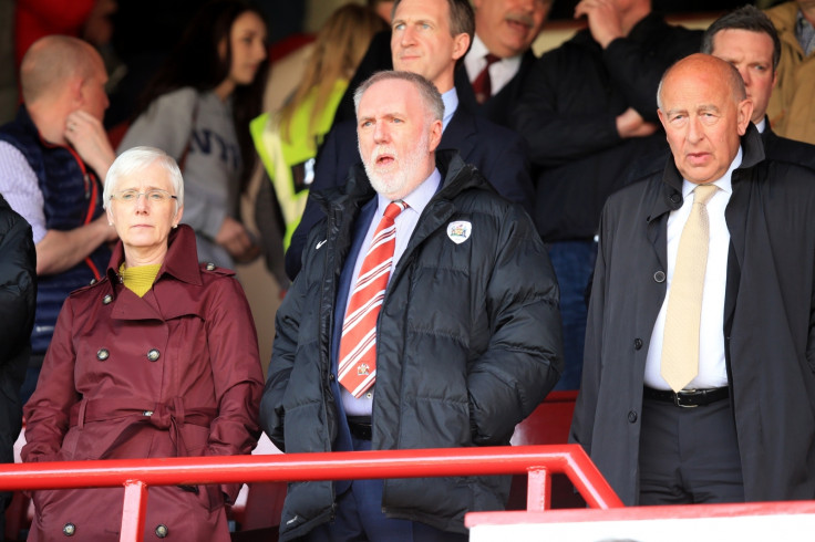 Barnsley Football Club, Patrick Cryne (middle), watching his team play at their Oakwell ground  