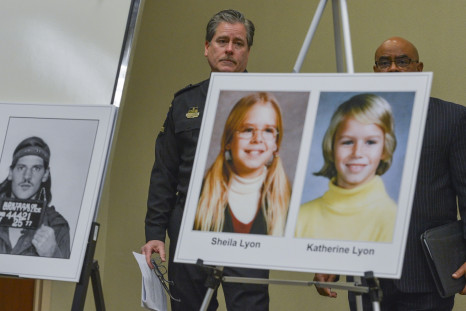 Montgomery County Police Captain Paul Starks, left, and Captain Marcus G. Jones stand behind a mug shot of Lloyd Lee Welch, Jr., who has now pleaded guilty to the murder of Katherine and Shelia Lyon, right, during a press conference in February 2014 in Ga