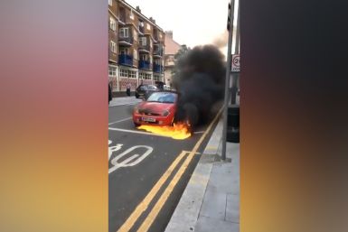Bystanders Attempt to Stop Rolling, Flaming Car In London