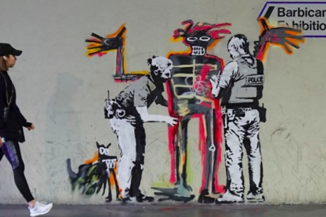 One of two new murals by street artist Banksy that that mark the opening of an exhibition by American artist Jean-Michel Basquiat in central London
