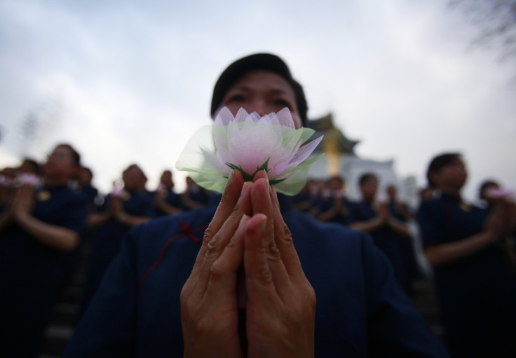 Buddhists pray during a ceremony to commemorate the birth of Buddha, at the Chiang Kai-shek Memorial Hall in Taipei May 8, 2011.