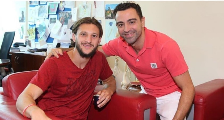 Adam Lallana and Xavi