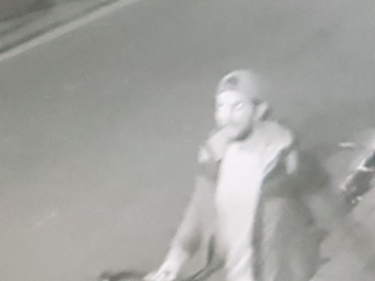 A CCTV camera picks up the girl stumbling down a side street near Bethnal Green station, east London, being followed by a different, bearded male, on a racing bicycle, who is believed to be the second suspect