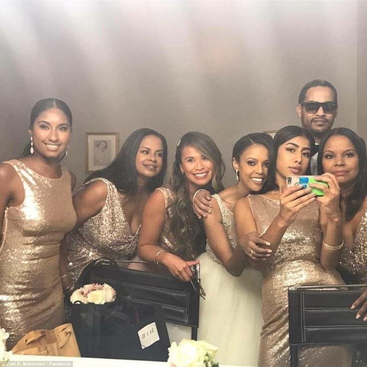 The bridal party relax at the reception at Foxchase Manor in Manassas, Virginia, with Austin fourth from left and Makonnen second from right  