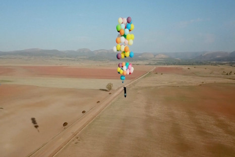 British Man Flies Over South Africa Using Only a Chair Tied to Helium Balloons