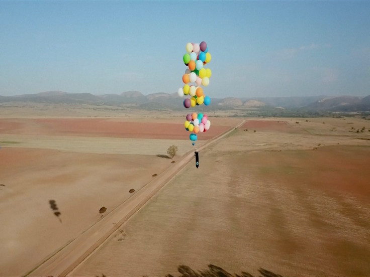British Man Flies Over South Africa Using Only a Chair Tied to Helium Balloons