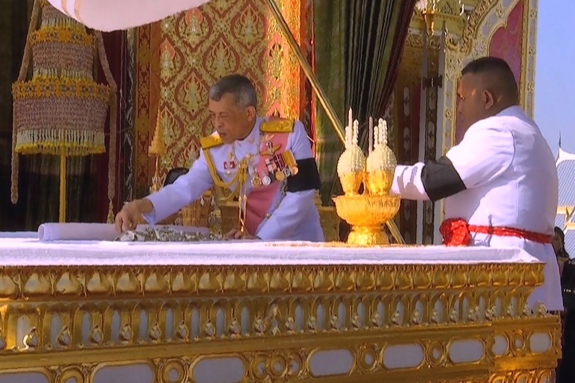 Thailand's new king picks through father's bones and ashes after