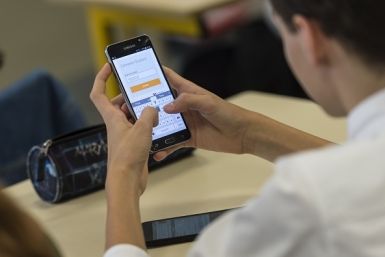 high school students use smartphones and tablet computers at the vocational school in Bischwiller, eastern France. Since the beginning of the school year in eastern France some 31,000 high school pupils have replaced their traditional textbooks by compute