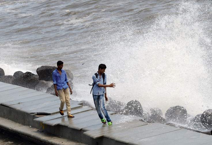 Young men by the ocean in Mumbai Young men by the ocean in Mumbai
