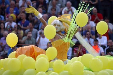 A man performs in the freestyle competition of the waterballet event on the pink friday party of the Gay Games in Cologne 2010