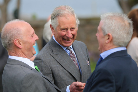 Prince Charles, Prince of Wales laughs as he is introduced to Lord Mountbatten's former staff by Peter McHugh (L) during a visit to the peace garden on May 20, 2015 in Sligo, Ireland