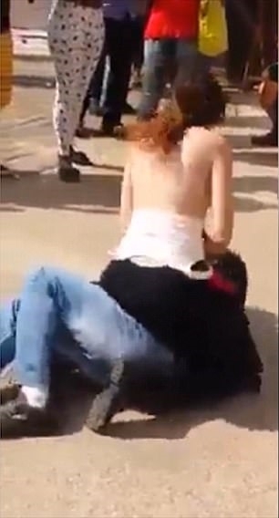 Woman in Brazil publicly rubs her bare breasts on a man's face in bizarre  anti-sexual harassment display, indy100
