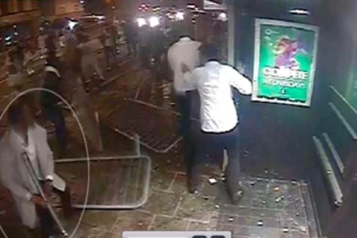 Hans Sojhe, who is charged with violent disorder, is circled in a still from the video about to throw a metal pole into a section of the crowd outside a club in Bristol