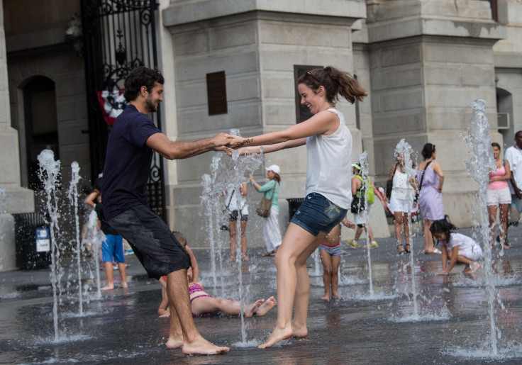 A couple plays in a fountain in front of City Hall in Philadelphia, but dating relationships across the US have become more complicated based on views around US President Donald Trump