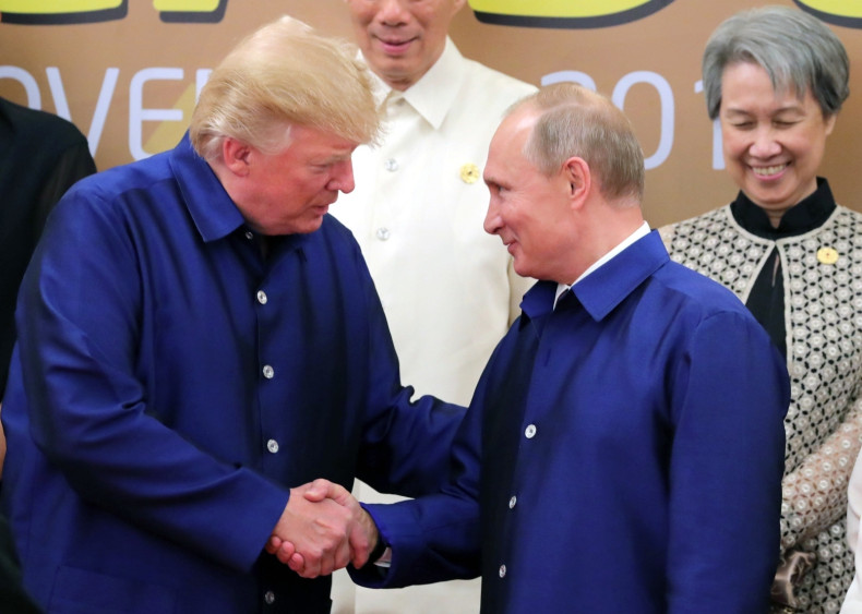 Trump and Putin shake hands in Vietnam