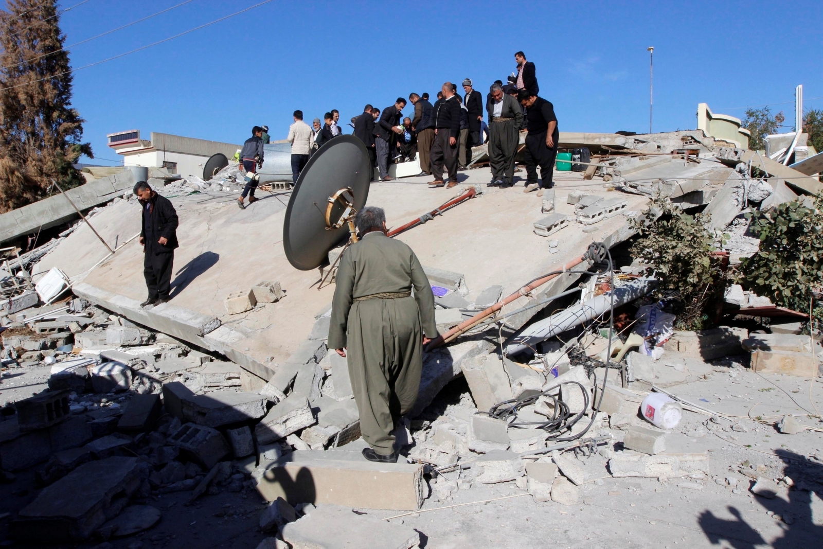 Iran-Iraq earthquake in pictures: Death toll rising as rescuers search ...