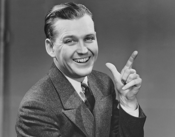 Man smiling and gesturing 