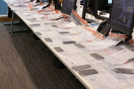 Suspect caught with 53 phones