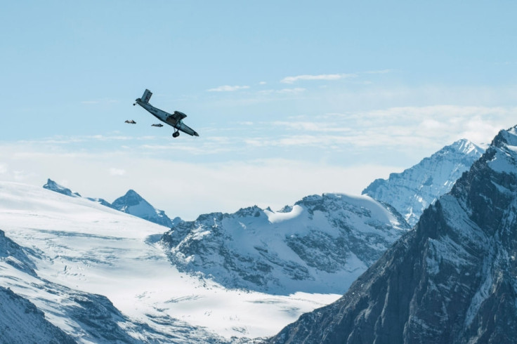 BASE jumpers chase the plane