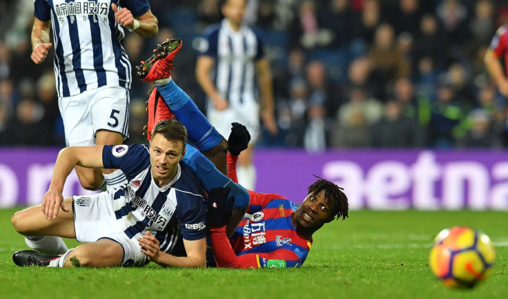 Jonny Evans and Wilfried Zaha