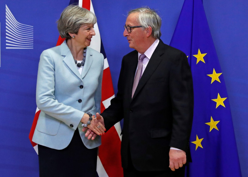 Theresa May Jean-Claude Juncker handshake