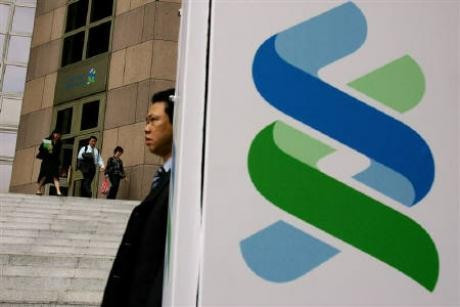 StanChart profit tops $3.1 bln as bad debts tumble