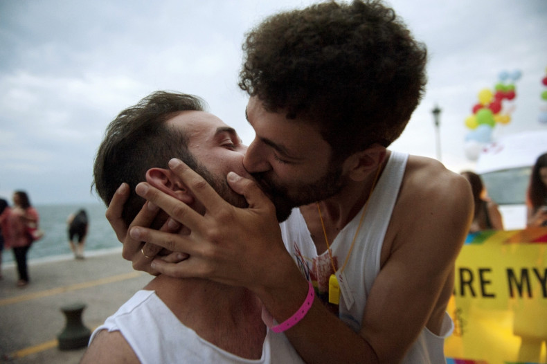 Two men kiss during a Gay Pride parade in the northern city of Thessaloniki