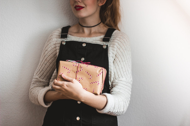 Woman holds Christmas gift 